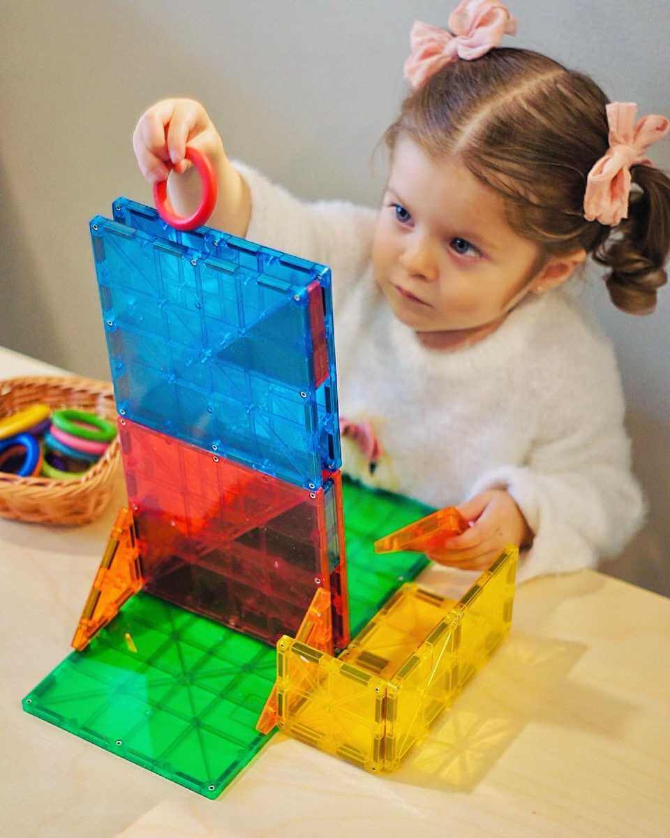 Girl playing with Magna-Tiles