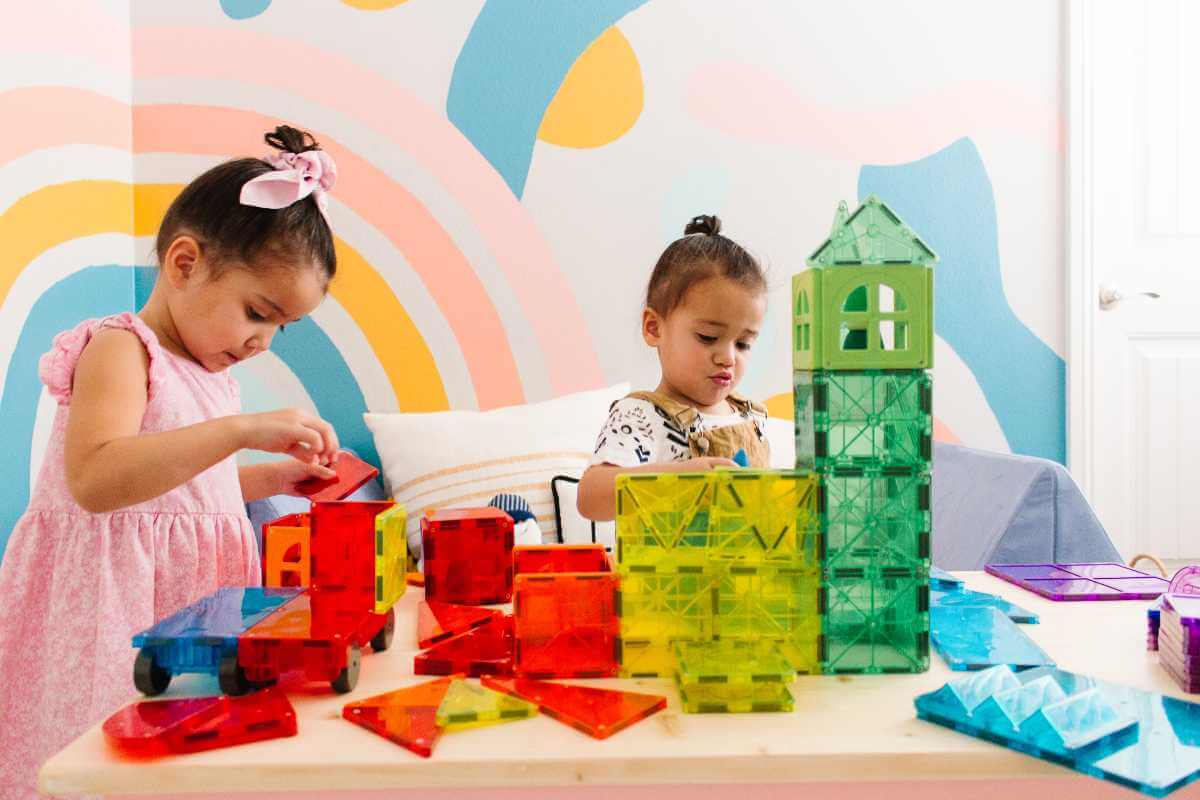 Girls playing with Magna-Tiles