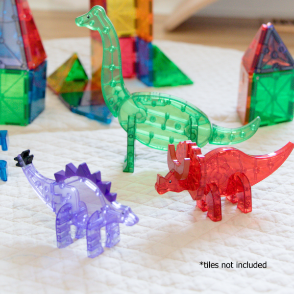 Green Brachiosaurus, red Triceratops, and purple Stegosaurus from MAGNA-TILES® Dinos 5-Piece Set.