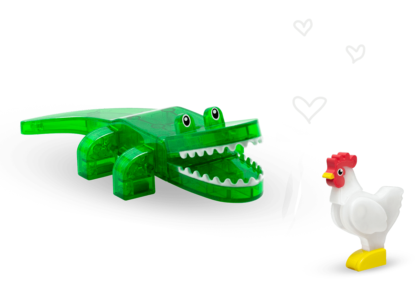 A green Magna-Tiles® caiman figure and a white Magna-Tiles® chicken figure