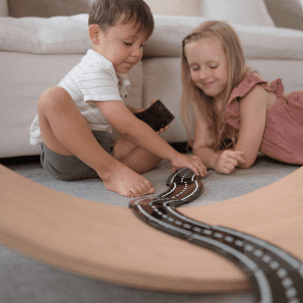 Children playing with XTRAS: Roads 12-Piece Set