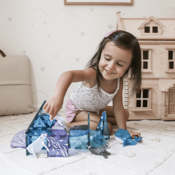 Child playing with MAGNA-TILES Arctic Set