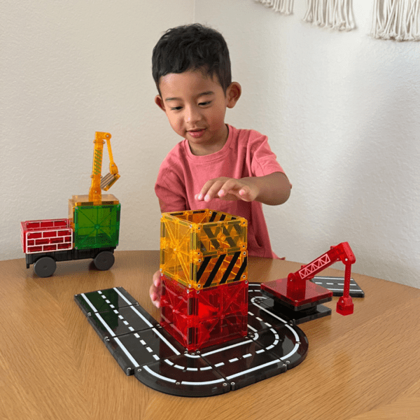 Child playing with Builder Set