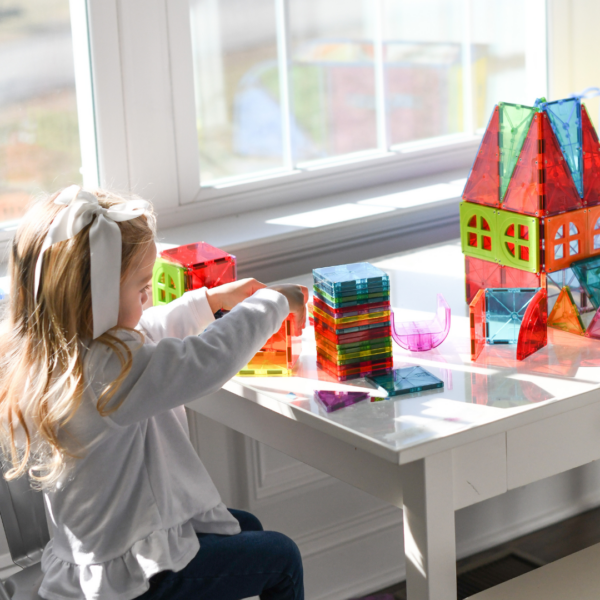 Child playing with MAGNA-TILES Metropolis Set