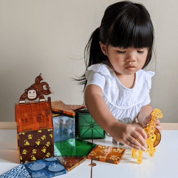 Child playing with MAGNA-TILES Safari Set